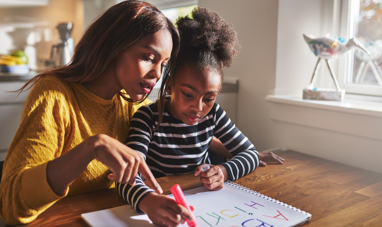 Little black girl learning to read Tutoring | Migration Resource Center